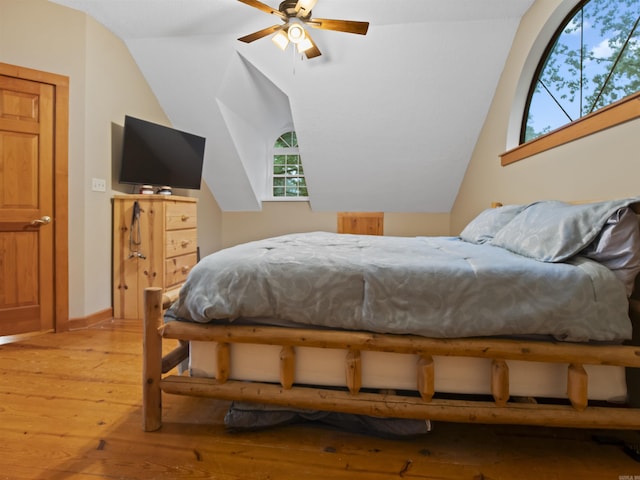 16 Almenara, Hot Springs Village, AR 71909 - bedroom with light wood-type flooring and vaulted ceiling