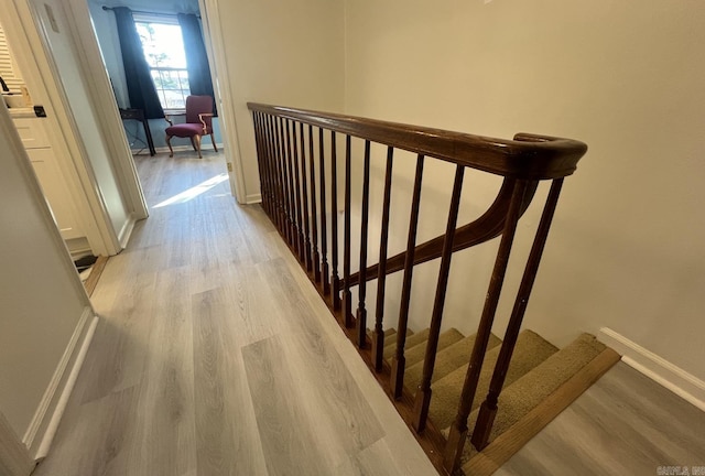 1824 N Hughes St, Little Rock, AR 72207 - corridor with light wood-style flooring, stairway, and an upstairs landing