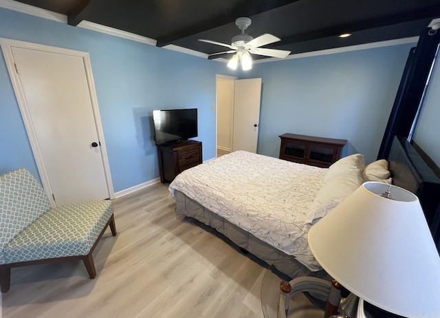 1824 N Hughes St, Little Rock, AR 72207 - bedroom with light wood-style floors, beamed ceiling, and a ceiling fan