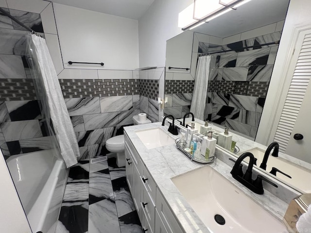 1824 N Hughes St, Little Rock, AR 72207 - bathroom with tile walls, double vanity, marble finish flooring, and shower / bathtub combination with curtain