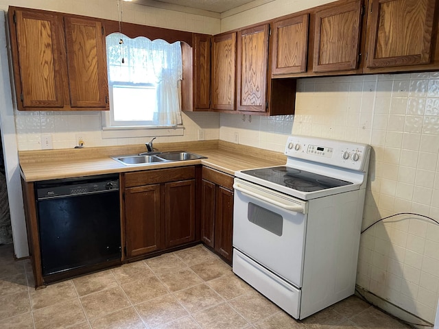 418 N Robinson St, Harrison, AR 72601 - kitchen featuring black dishwasher, electric stove, light countertops, and decorative backsplash