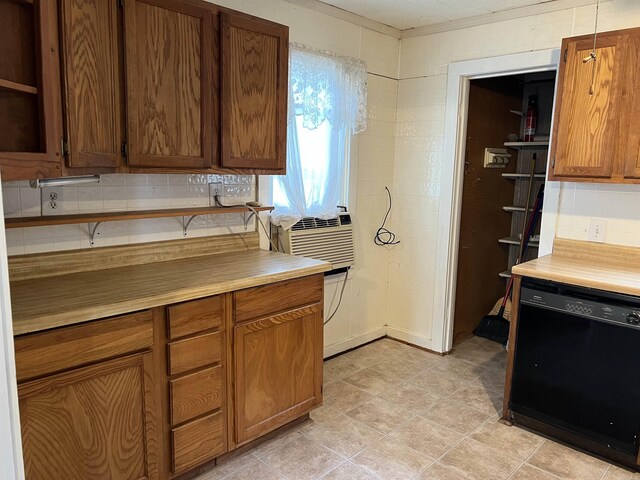 418 N Robinson St, Harrison, AR 72601 - kitchen featuring black dishwasher, open shelves, light countertops, brown cabinets, and cooling unit