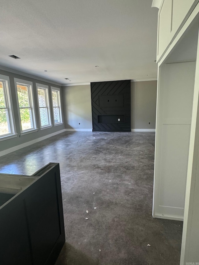 5 Ridge View St, Vilonia, AR 72173 - unfurnished living room with crown molding and concrete floors