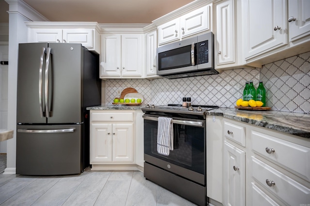 7139 Park Meadows Dr, Sherwood, AR 72120 - kitchen with appliances with stainless steel finishes, white cabinets, decorative backsplash, and light stone counters