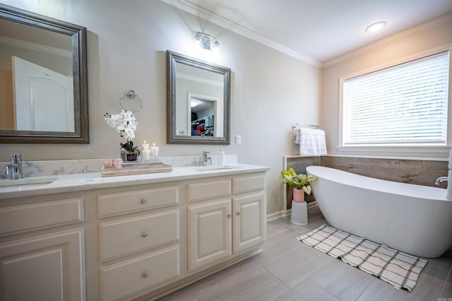 7139 Park Meadows Dr, Sherwood, AR 72120 - bathroom with double vanity, a freestanding tub, and crown molding