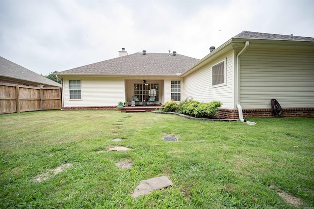 7139 Park Meadows Dr, Sherwood, AR 72120 - rear view of property featuring a ceiling fan and a chimney