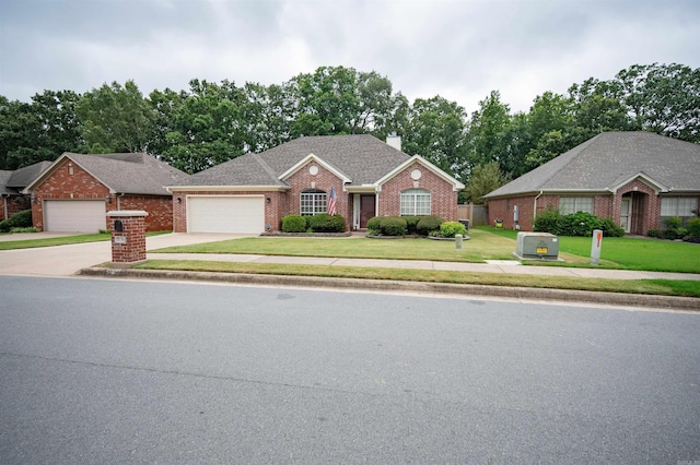 7139 Park Meadows Dr, Sherwood, AR 72120 - view of front of property featuring brick siding, a chimney, a front yard, a garage, and driveway