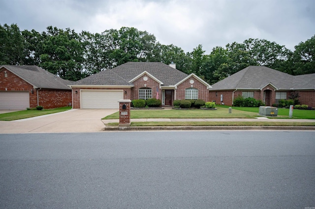 7139 Park Meadows Dr, Sherwood, AR 72120 - ranch-style house featuring a garage, driveway, brick siding, and a front lawn