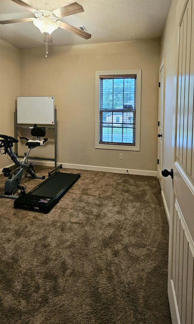 795 S Hill Dr, Jonesboro, AR 72401 - exercise room featuring ceiling fan and dark carpet