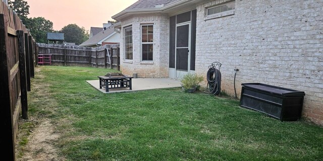 795 S Hill Dr, Jonesboro, AR 72401 - yard at dusk with a fenced backyard and a patio