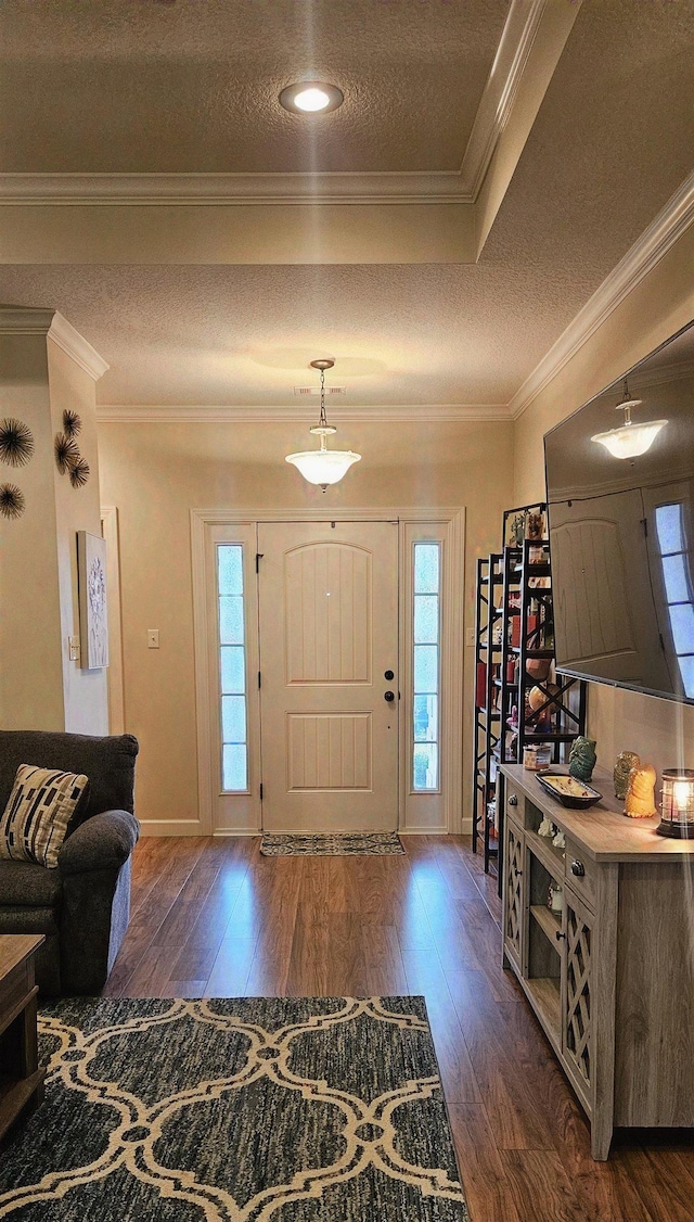 795 S Hill Dr, Jonesboro, AR 72401 - foyer entrance with dark wood-style flooring, a textured ceiling, and crown molding