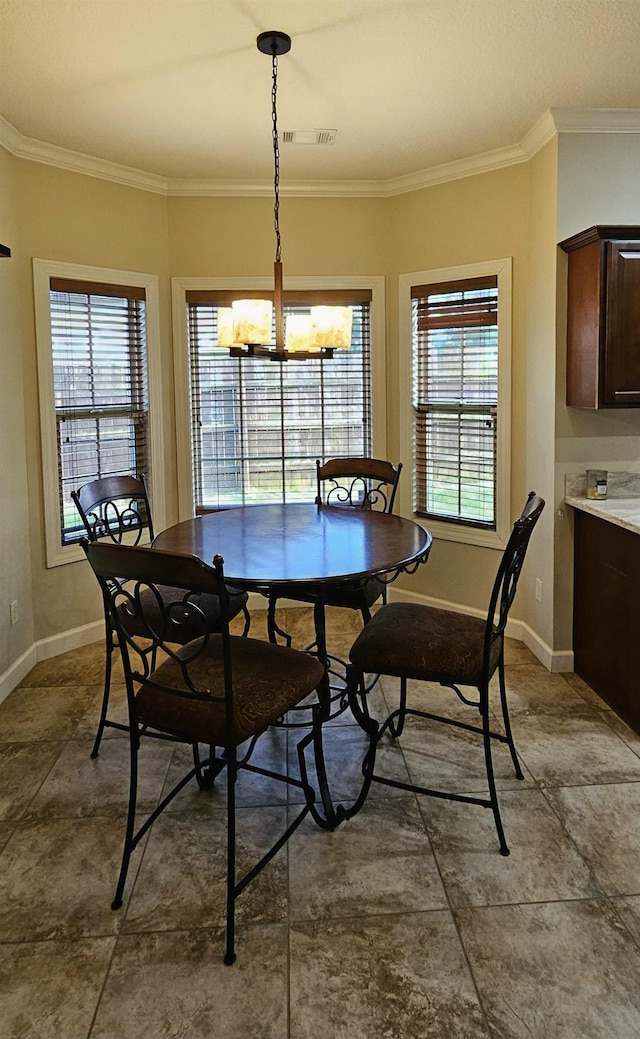 795 S Hill Dr, Jonesboro, AR 72401 - dining area featuring a chandelier and ornamental molding