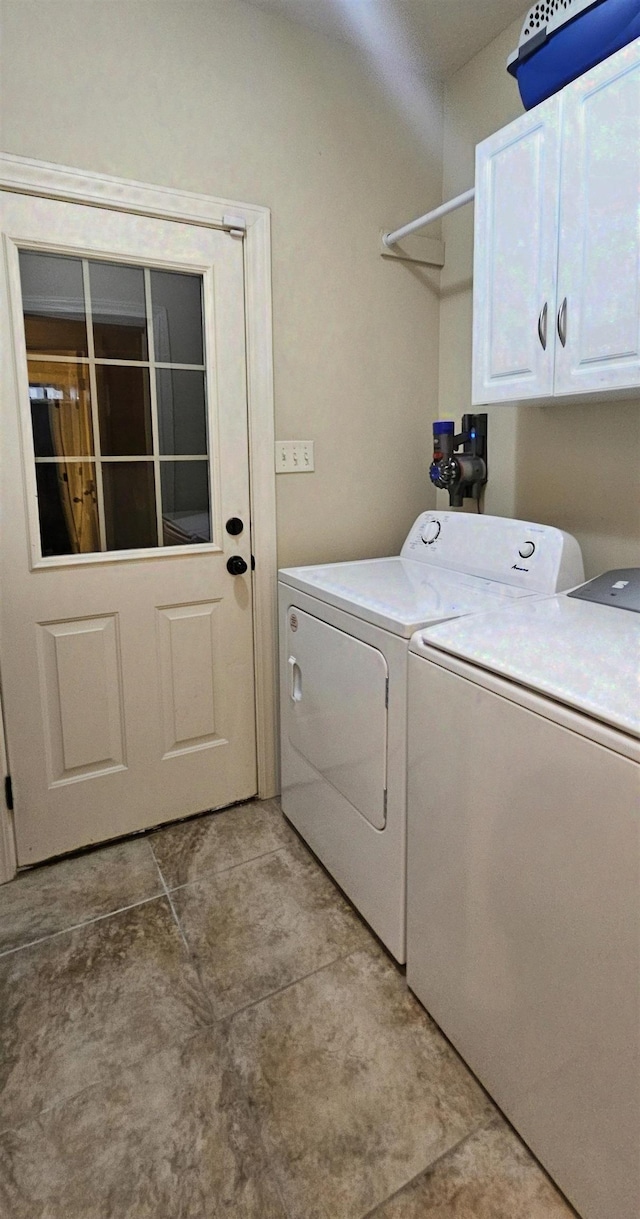 795 S Hill Dr, Jonesboro, AR 72401 - laundry area with cabinet space, independent washer and dryer, and light tile patterned flooring
