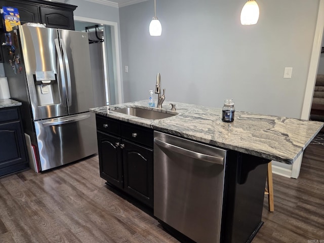 1209 Rehoboth, Searcy, AR 72143 - kitchen featuring stainless steel appliances, crown molding, dark wood-style floors, an island with sink, and light stone countertops