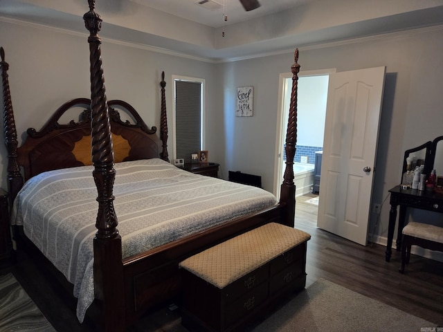 1209 Rehoboth, Searcy, AR 72143 - bedroom featuring dark wood finished floors, ornamental molding, and a tray ceiling