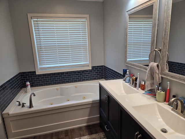 1209 Rehoboth, Searcy, AR 72143 - full bathroom featuring double vanity, a whirlpool tub, and wood finished floors