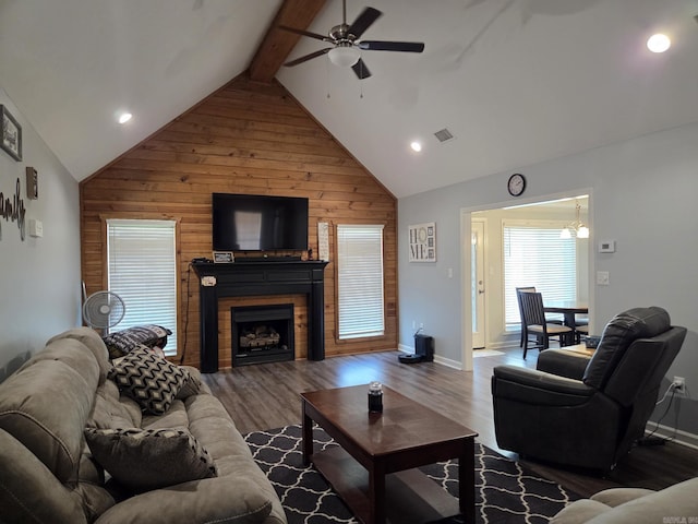 1209 Rehoboth, Searcy, AR 72143 - living area featuring ceiling fan, wood walls, a fireplace, wood finished floors, and high vaulted ceiling