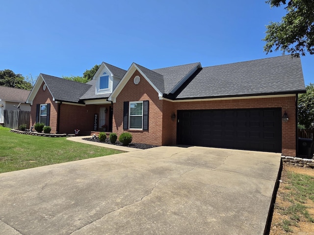 1209 Rehoboth, Searcy, AR 72143 - view of front facade with brick siding, driveway, a garage, and roof with shingles