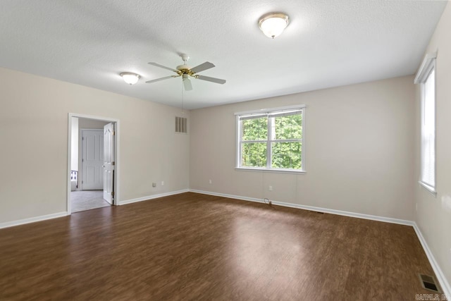 1226 Grayson Cir, Malvern, AR 72104 - unfurnished room with dark wood-style flooring, ceiling fan, and a textured ceiling