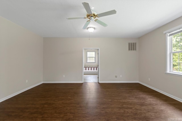 1226 Grayson Cir, Malvern, AR 72104 - empty room with dark wood-type flooring and a ceiling fan