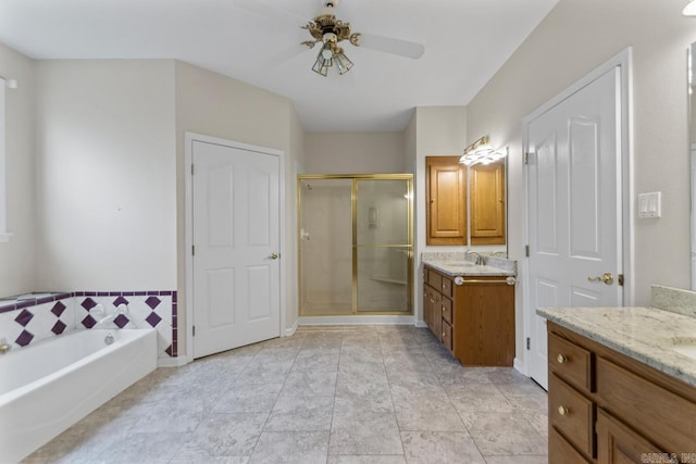 1226 Grayson Cir, Malvern, AR 72104 - full bath featuring a stall shower, two vanities, a ceiling fan, and a bath