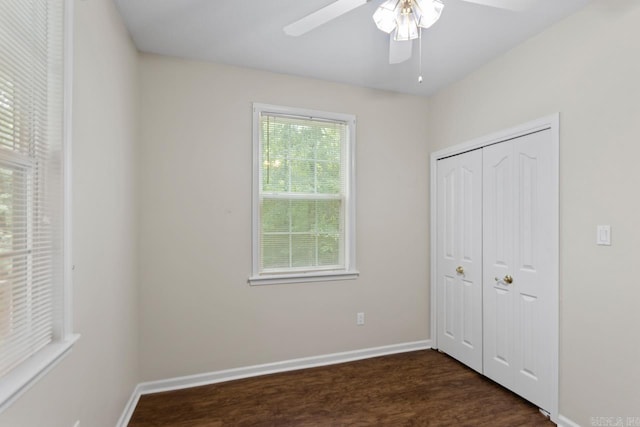 1226 Grayson Cir, Malvern, AR 72104 - unfurnished bedroom with dark wood-type flooring, a closet, and a ceiling fan