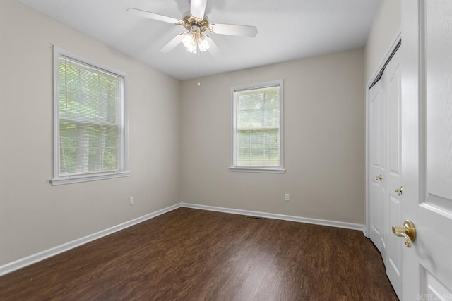 1226 Grayson Cir, Malvern, AR 72104 - unfurnished bedroom with dark wood-style floors, a closet, and ceiling fan