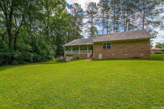 1226 Grayson Cir, Malvern, AR 72104 - back of property featuring brick siding, a yard, a porch, and crawl space