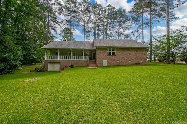 1226 Grayson Cir, Malvern, AR 72104 - rear view of house featuring covered porch, a lawn, an attached garage, and crawl space