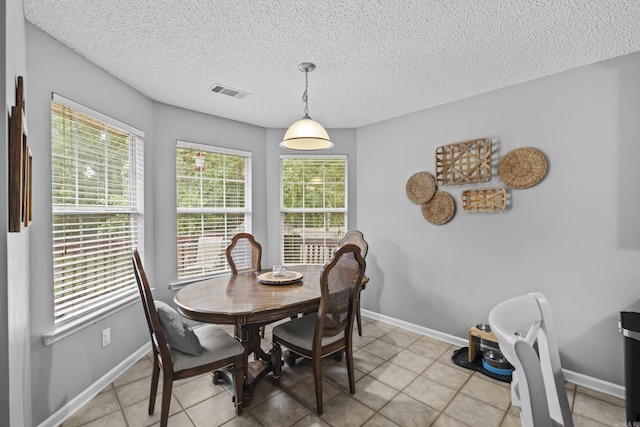 5132 Austin Lakes Cir, Sherwood, AR 72120 - dining room featuring a textured ceiling and light tile patterned floors