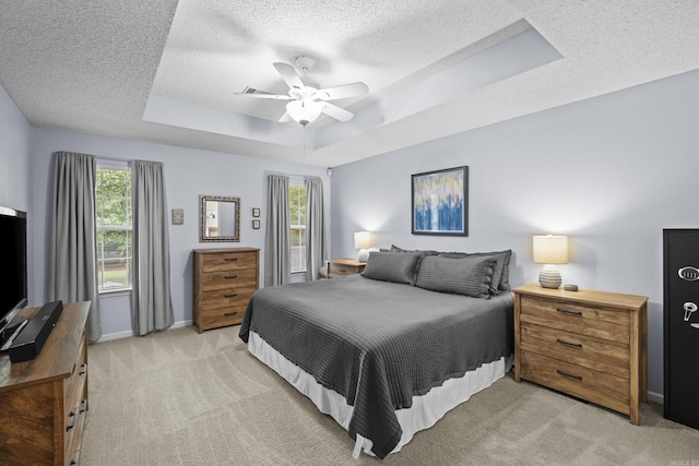 5132 Austin Lakes Cir, Sherwood, AR 72120 - bedroom featuring a raised ceiling, a textured ceiling, light colored carpet, and ceiling fan