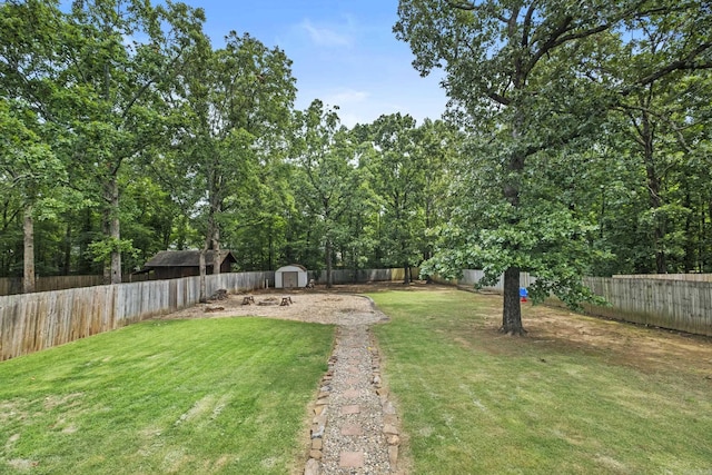 5132 Austin Lakes Cir, Sherwood, AR 72120 - fenced backyard featuring a storage unit