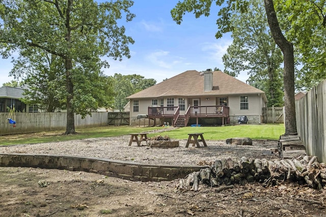 5132 Austin Lakes Cir, Sherwood, AR 72120 - rear view of property featuring an outdoor fire pit, a deck, and a fenced backyard