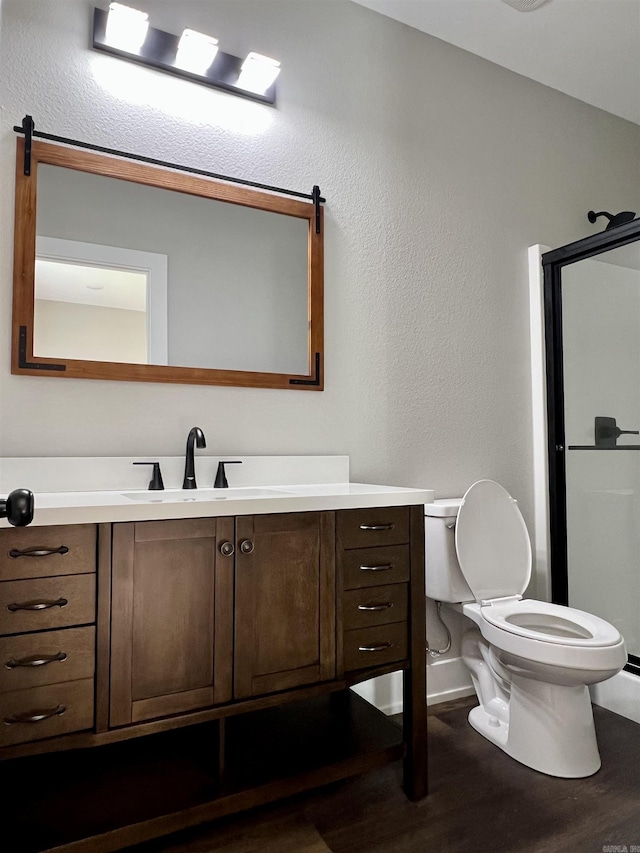 112 S Eagle, Sheridan, AR 72150 - full bath featuring wood finished floors, vanity, a shower stall, and a textured wall
