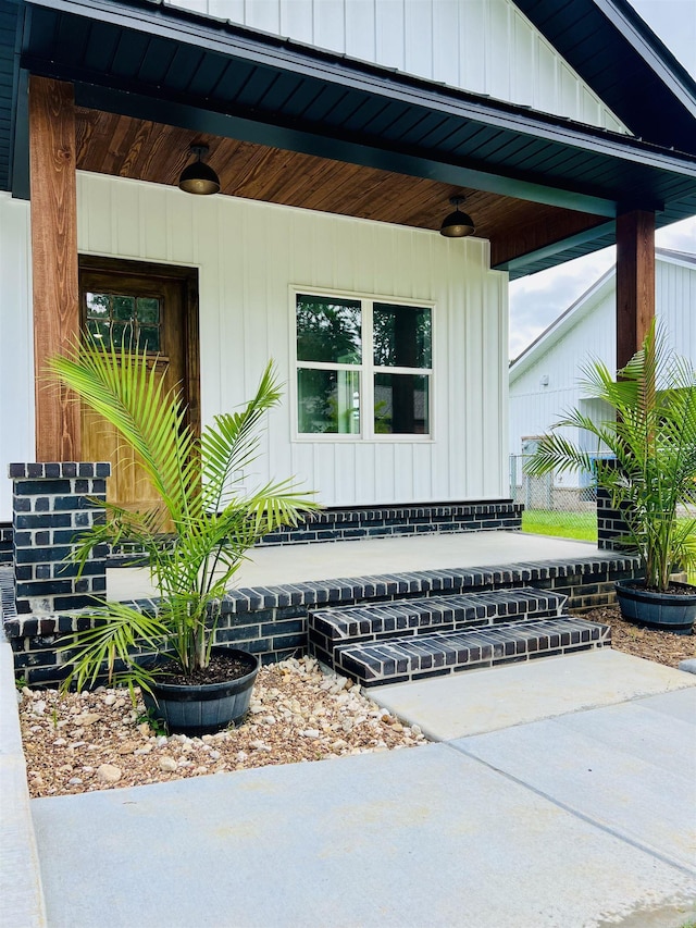 112 S Eagle, Sheridan, AR 72150 - view of side of property with a porch and board and batten siding