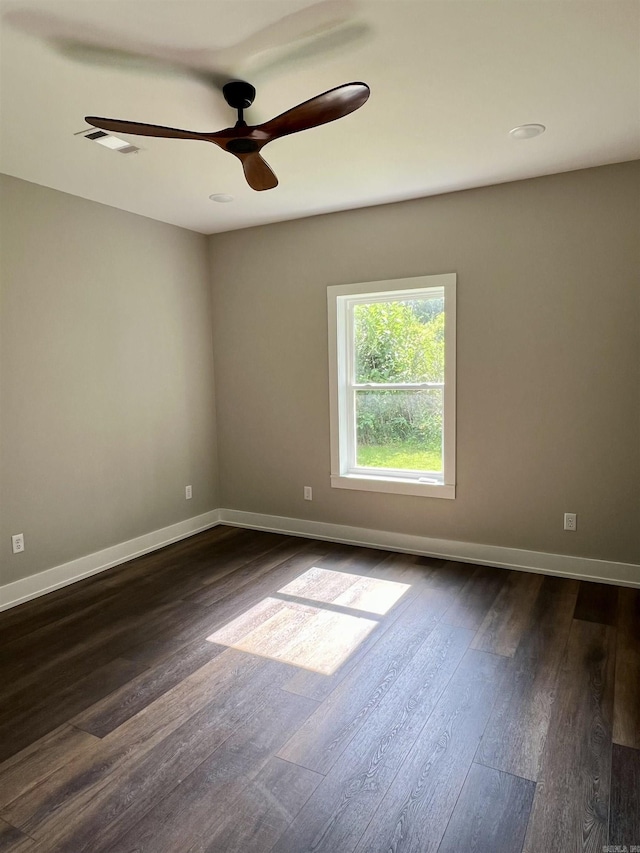 112 S Eagle, Sheridan, AR 72150 - unfurnished room featuring dark wood finished floors and a ceiling fan