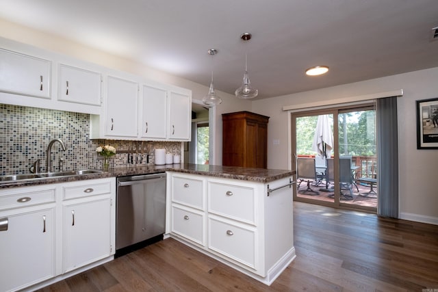 2908 Breckenridge Dr, Little Rock, AR 72227 - kitchen with stainless steel dishwasher, dark countertops, a peninsula, and white cabinets