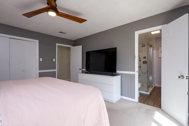 2908 Breckenridge Dr, Little Rock, AR 72227 - bedroom featuring ensuite bathroom, a closet, a ceiling fan, a textured ceiling, and light carpet