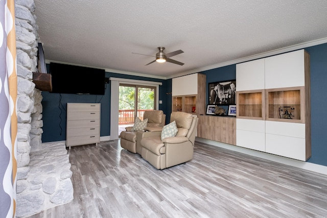 2908 Breckenridge Dr, Little Rock, AR 72227 - living area with ornamental molding, a ceiling fan, a textured ceiling, and light wood-style floors