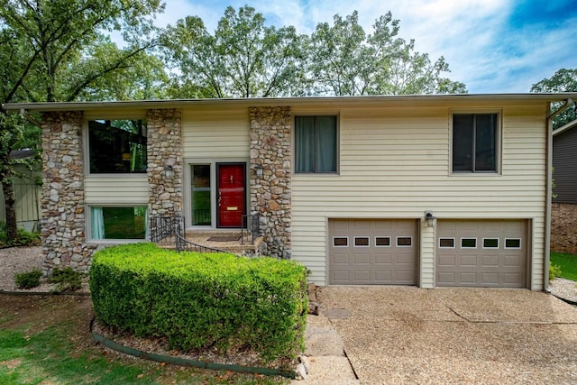 2908 Breckenridge Dr, Little Rock, AR 72227 - split foyer home with an attached garage, driveway, and stone siding