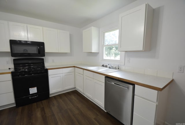 kitchen with black appliances, dark wood finished floors, white cabinetry, and light countertops