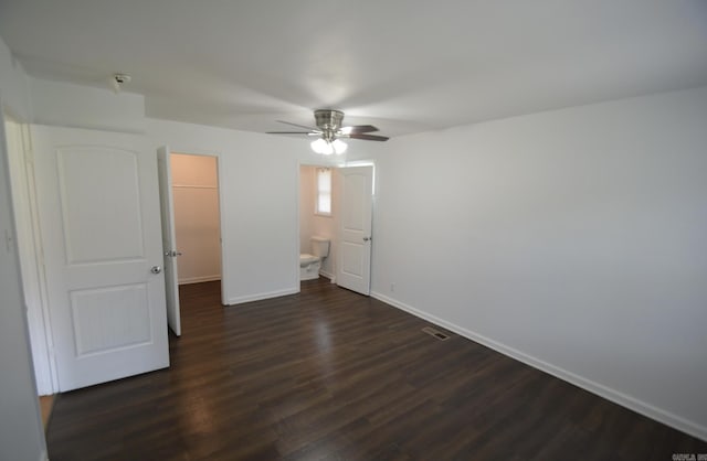 unfurnished bedroom with dark wood-type flooring and a ceiling fan