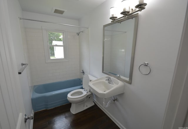 bathroom with wood finished floors and shower / bathtub combination