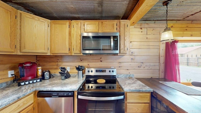 25 Jared Cir, Heber Springs, AR 72543 - kitchen with stainless steel appliances, wooden walls, light brown cabinetry, hanging light fixtures, and light stone counters