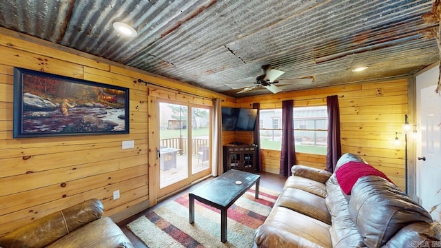 25 Jared Cir, Heber Springs, AR 72543 - living room with wood walls, plenty of natural light, and ceiling fan