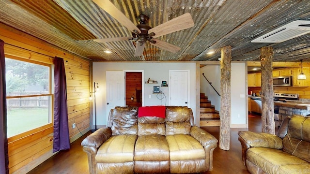 25 Jared Cir, Heber Springs, AR 72543 - living area with stairway, wooden walls, wood finished floors, ceiling fan, and recessed lighting