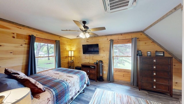 25 Jared Cir, Heber Springs, AR 72543 - bedroom with wood walls, wood finished floors, and ceiling fan