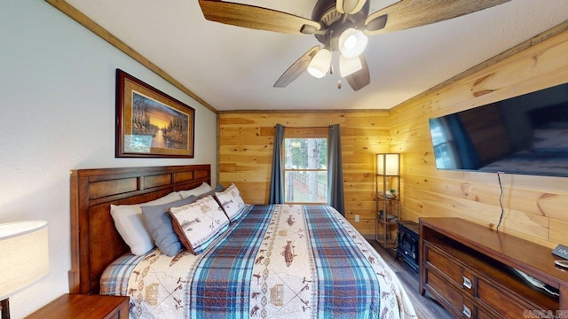 25 Jared Cir, Heber Springs, AR 72543 - bedroom with wood walls, ceiling fan, and ornamental molding
