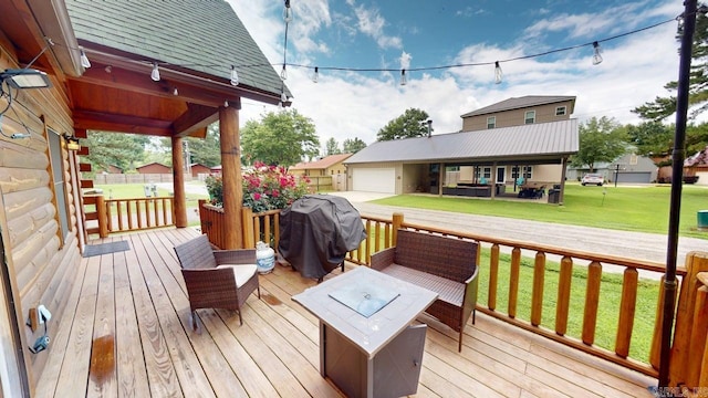 25 Jared Cir, Heber Springs, AR 72543 - wooden porch with grilling area, a lawn, and a garage