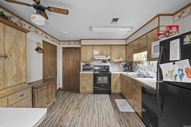 309 N Seaman St, Mccrory, AR 72101 - kitchen featuring black appliances, under cabinet range hood, light wood finished floors, a ceiling fan, and light countertops
